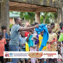 Mission volunteers sharing clothing with community members