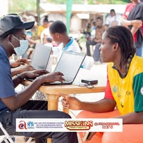 A community member registering at the Axim medical outreach