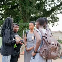 Mission team members speaking with people during outreach