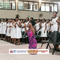 Young people worshipping together at an Axim mission event